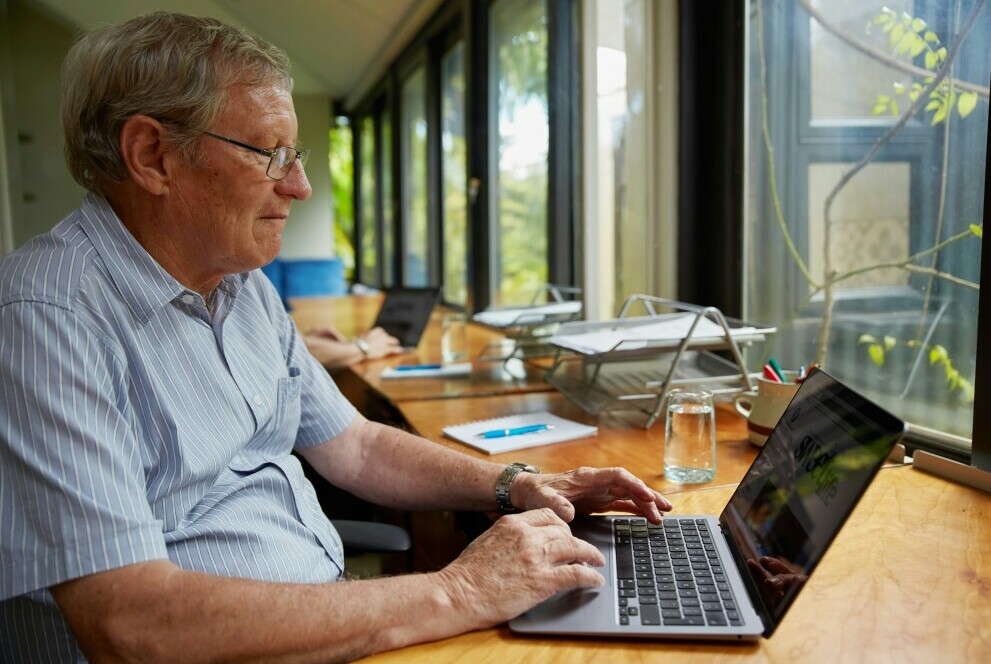 Retiree working on a computer